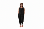A woman modeling a black sleeveless button-front top and matching black pants against a plain white background. Snazzy Sproglets