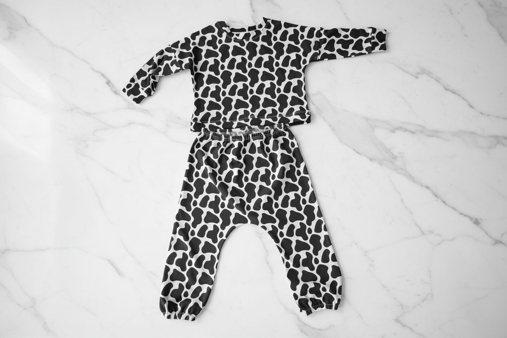 Children's outfit with black and white pattern on a white background