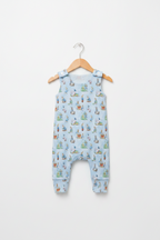 A baby romper in light blue with an all-over print of Peter Rabbit characters, hanging on a wooden hanger against a clean white background. Snazzy Sproglets