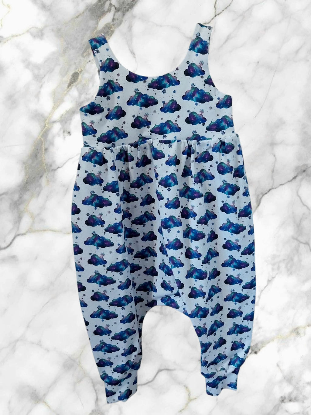Children's boho romper with blue clouds pattern