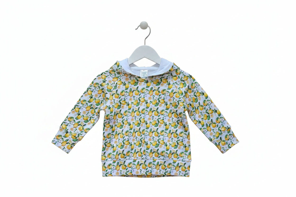 A children's long-sleeve hooded sweatshirt with an all-over lemon and white floral print, laid flat against a white background.