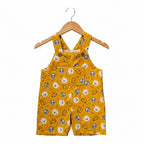 A pair of yellow baby overalls with an all-over cartoon animal face print, featuring a front pocket and shoulder straps, shown against a plain white background.Snazzy Sproglets