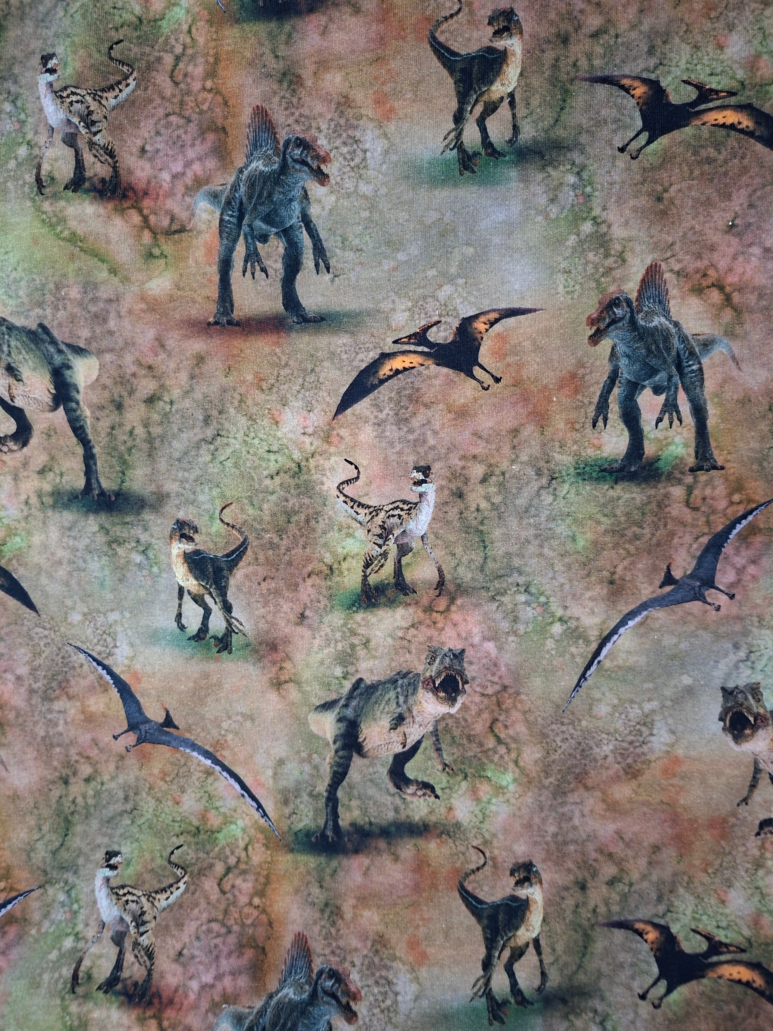 Pattern of various dinosaurs on a textured background