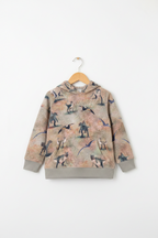 A children's hooded sweatshirt hanging on a wooden hanger against a plain white background. The sweatshirt has an all-over dinosaur print on a warm beige and light brown base, with solid gray ribbed cuffs and hem. Snazzy Sproglets