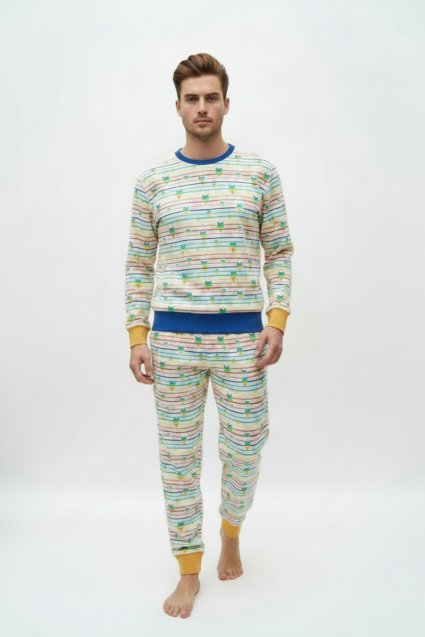 A man modeling a matching two-piece pajama set with a colorful horizontal stripe pattern and yellow cuffs, on a plain white studio background.