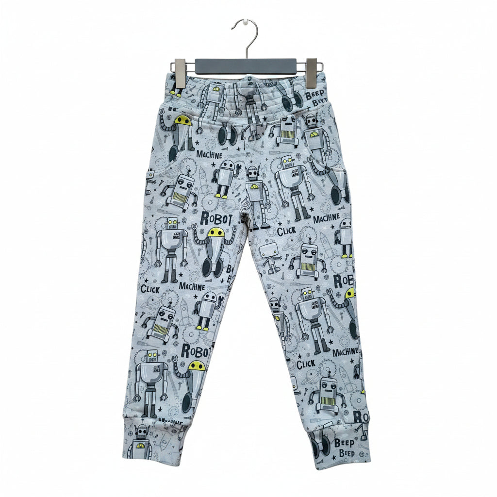 Light blue jogger pants with an all-over cartoon robot print, featuring a matching elastic waistband and cuffed ankles.