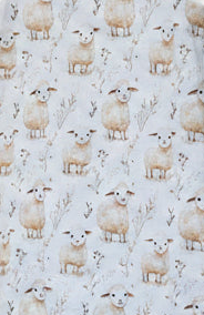 A close-up of fabric featuring a repeating pattern of cream-colored sheep on a light off-white background.snazzy sproglets