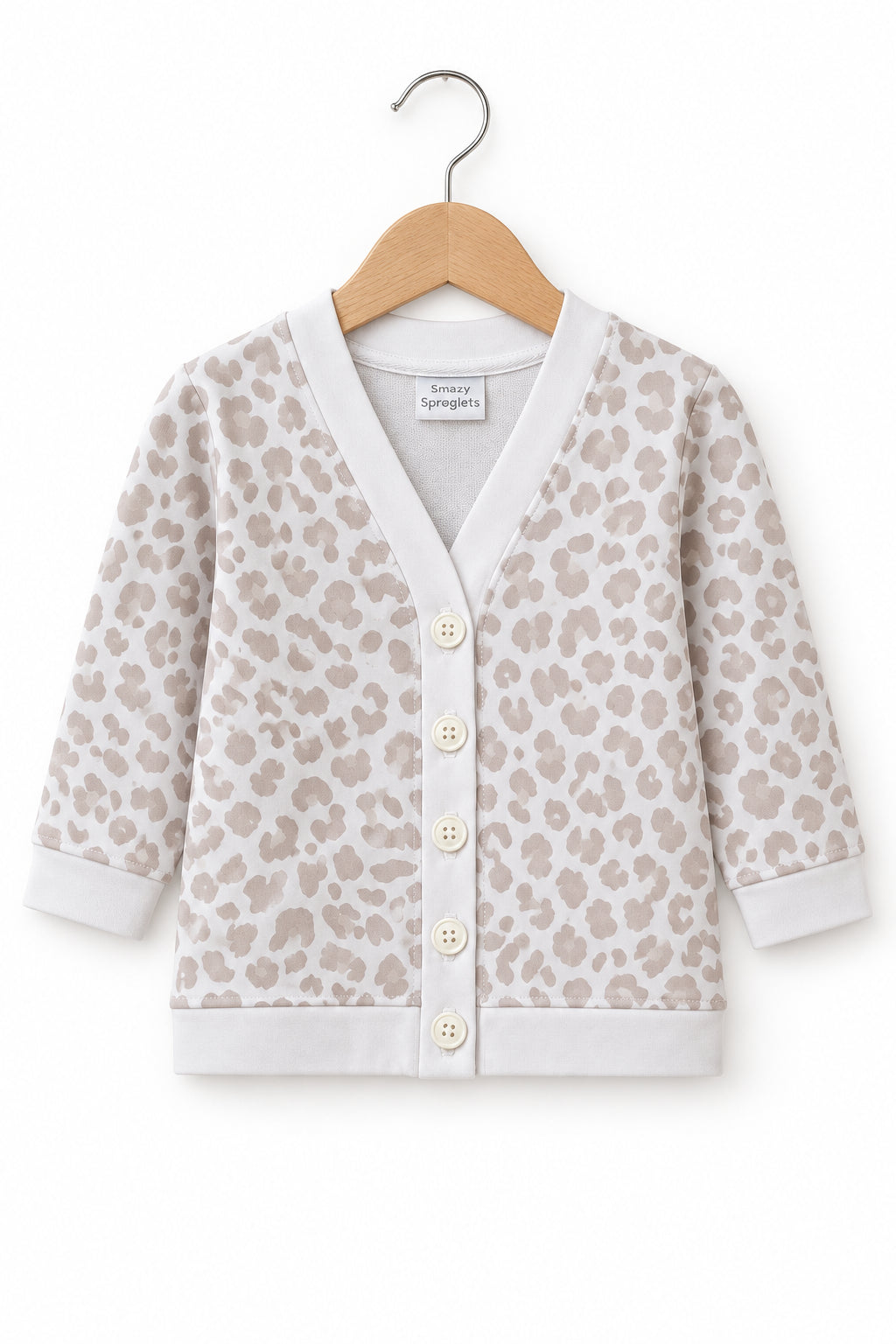 A baby cardigan sweater with a beige and off-white leopard print pattern, featuring a button-up front and ribbed trim.